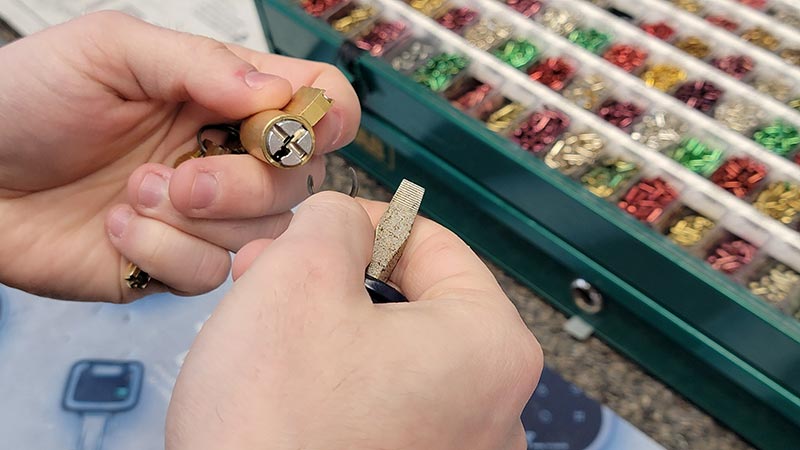 Lock cylinder and pins being rekeyed