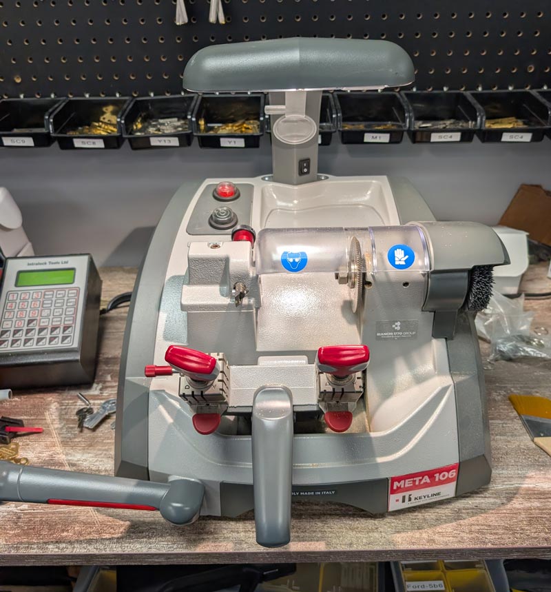 Key duplicator machine cutting a spare key